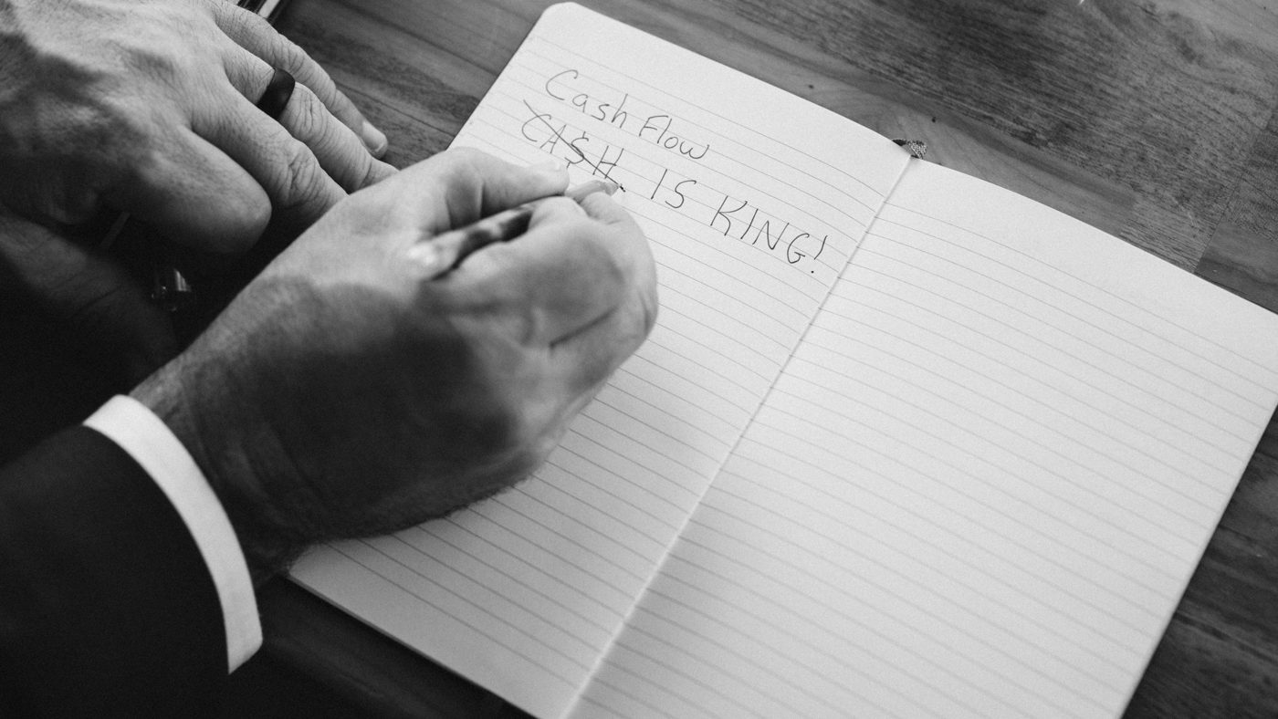 Handwritten note reading Cash Flow is King