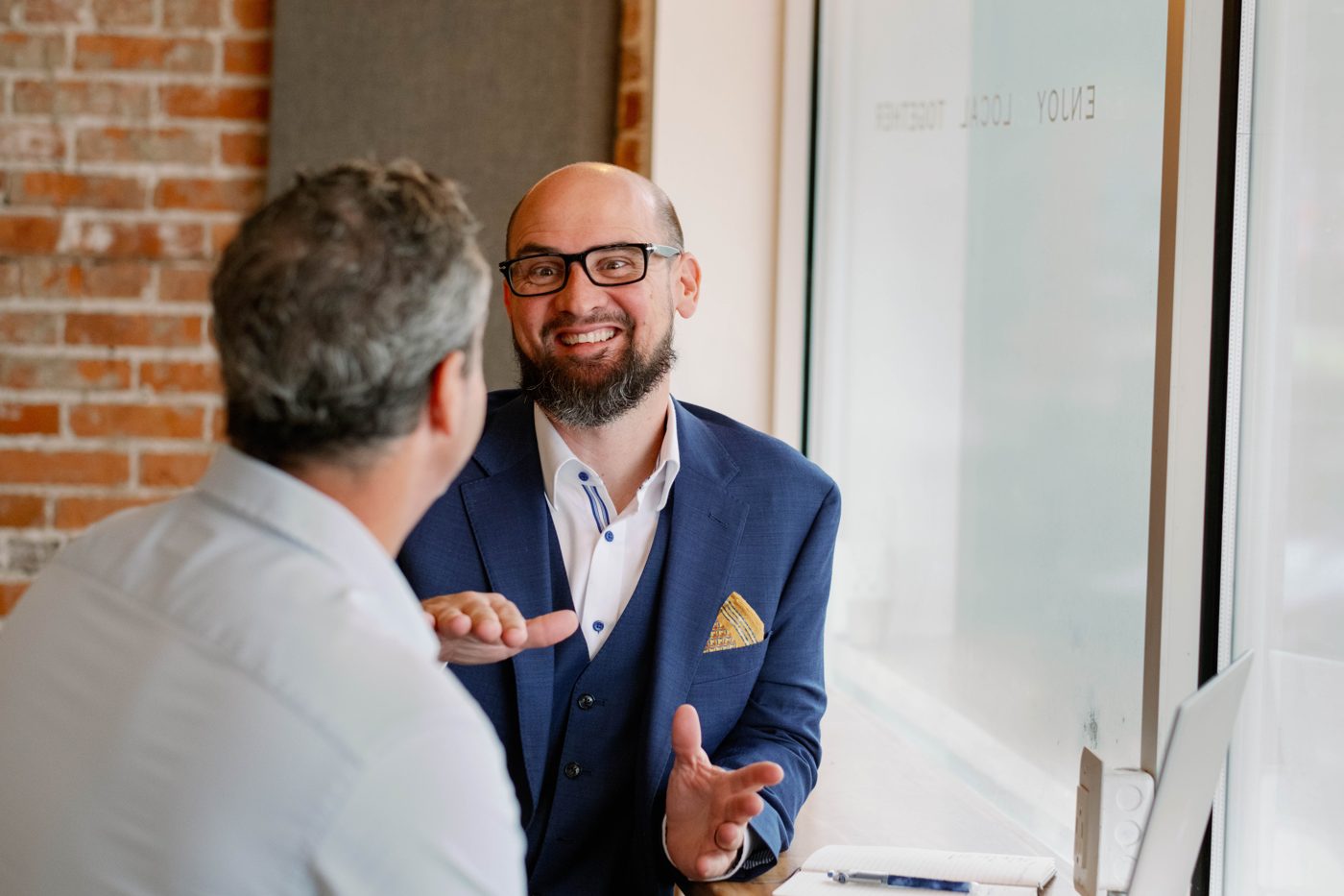 A Quiver Cashflow advisor meeting with a business owner